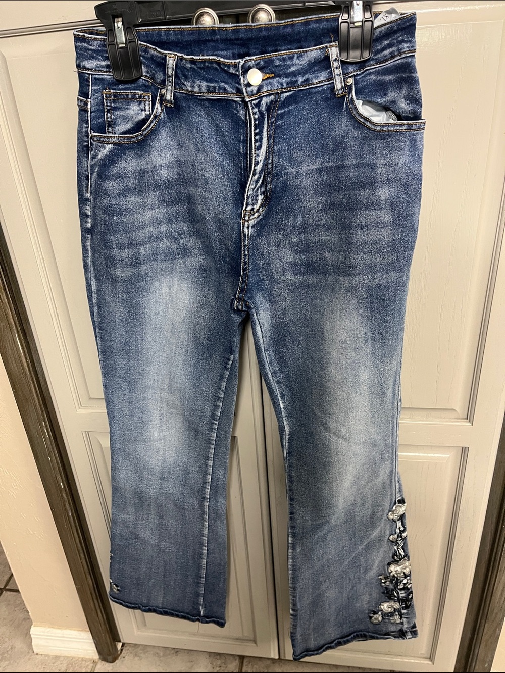 Blue Distressed Flare Jeans with Embellished Hem